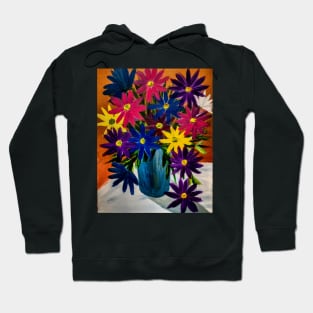 A lovely boutique of abstract vibrant bright colorful  flowers in a tall turquoise glass vase Hoodie